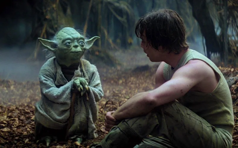 Yoda sendo mentor de Luke Skywalker